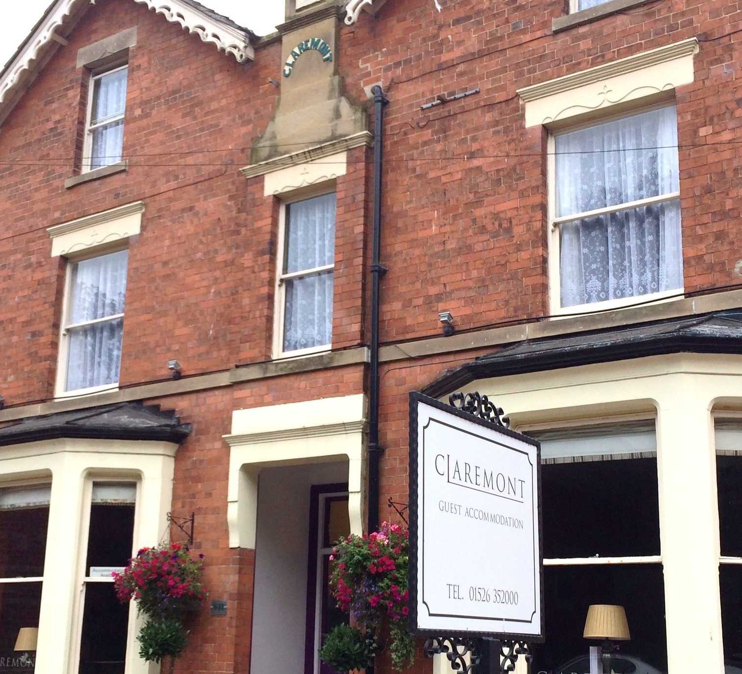The Claremont's red-brick frontage and sign on Witham Road