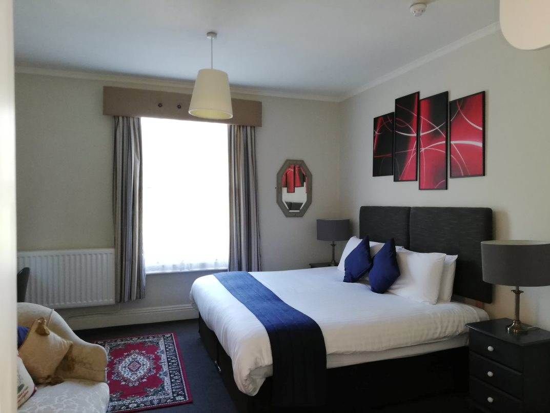 Double room with navy throw