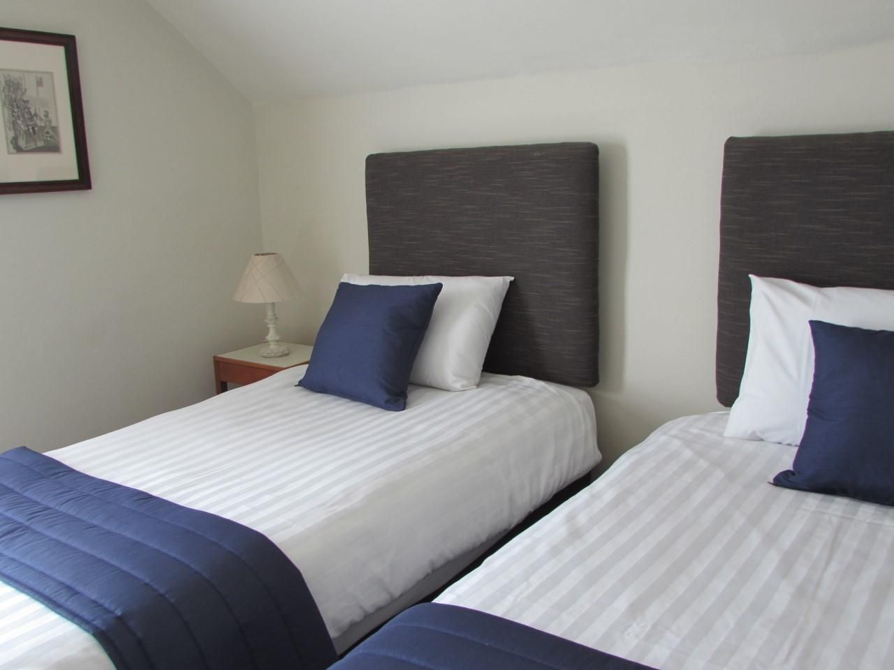 Crisp bedding and navy cushions